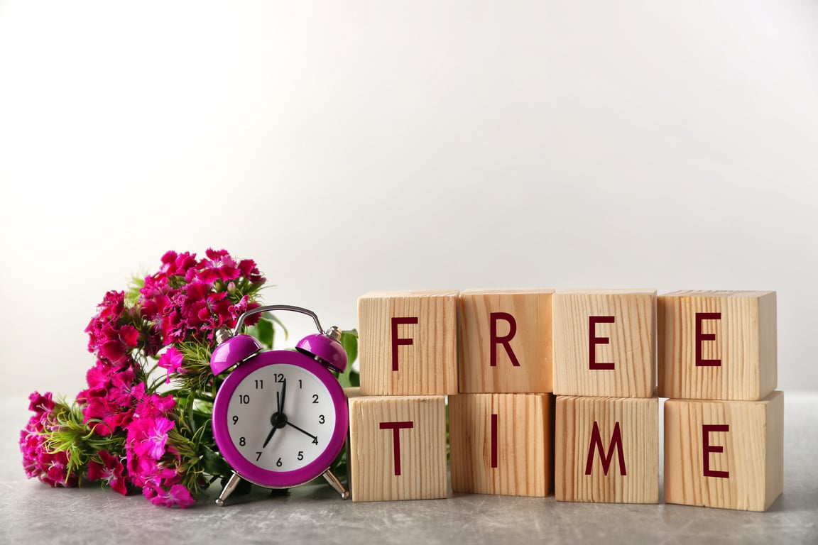 Wooden Cubes with Free Time Text, Clock, and Flowers 